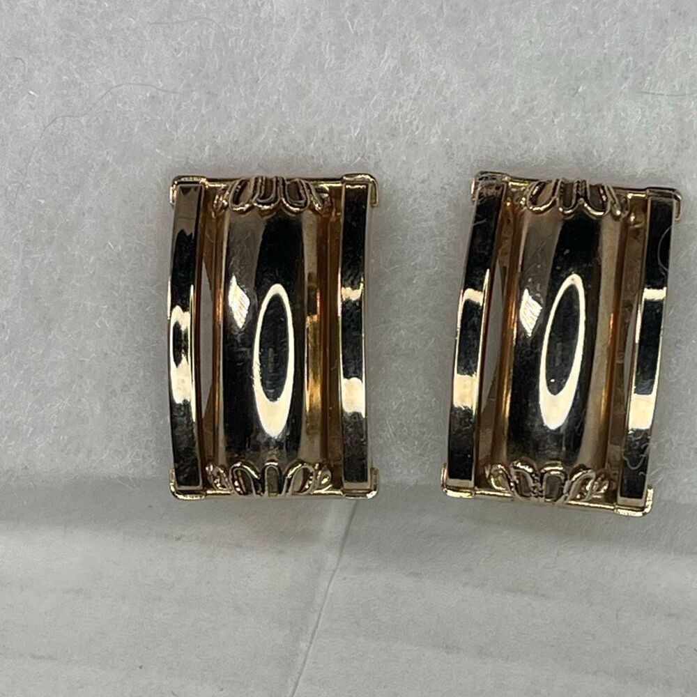 Vintage rectangular slightly curved highly polished clip earrings.